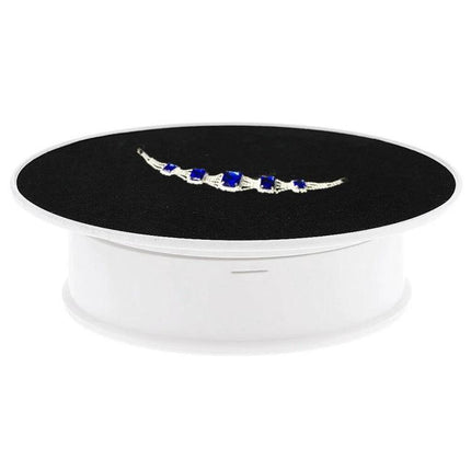 30cm Electric Rotating Turntable for Photography Displays with black velvet top and white ABS base showcasing jewelry