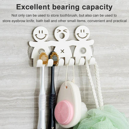 Smiley Face Suction Cup Holder for Everyday Bathroom Storage mounted on tile holding toothbrushes and bath accessories, white smiling design
