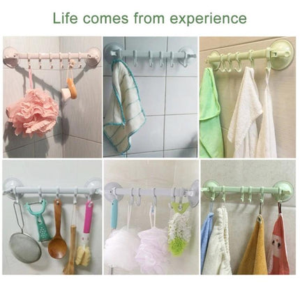 Practical Wall Hook for Everyday Towel Storage in Kitchen or Bathroom showing multiple colored hooks holding towels, loofahs and kitchen utensils