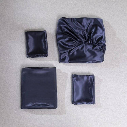 Home Silk-Like Bedding Set, 4-Piece US King Size Bed navy silk-like quilted set laid flat on neutral background