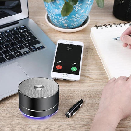 LENRUE Portable Bluetooth Speaker With Blue Ambient Light on desk with phone receiving call laptop notebook 100 chars