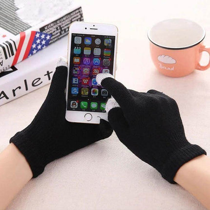 Winter Touch Screen Gloves Unisex Everyday Warm Mittens shown in black knit with conductive white fingertips using smartphone for commuting and office tasks
