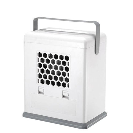 Compact Desktop Air Cooler for Portable Home and Office Use with Dual Power Options on desk, white portable unit with handle and honeycomb vent
