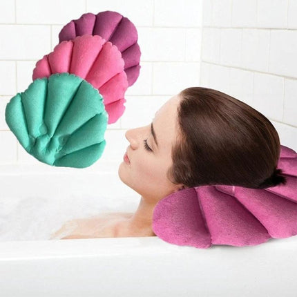 An Inflatable Pillow for Comfortable Home Baths - contoured shell-shaped bath pillow providing neck and head support with adjustable firmness