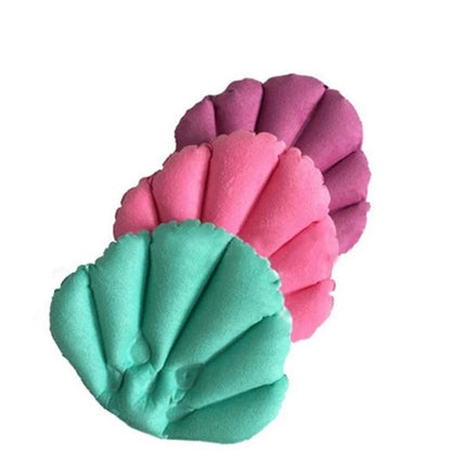 An Inflatable Pillow for Comfortable Home Baths - three scallop-shaped inflatable bath pillows in teal, pink, and purple offering neck support for tub relaxation