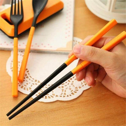 3 In 1 ABS Folding Dinnerware Cutlery Set With Storage Box For Camping shown as compact orange and black folding chopsticks and utensils