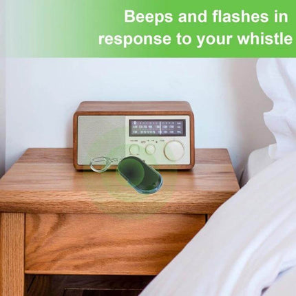 Portable Whistle-Activated Key Finder with LED Light and Sound on nightstand beeping and flashing to locate keys