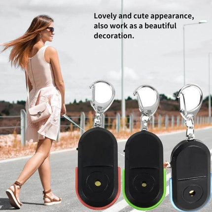 Portable Whistle-Activated Key Finder with LED Light and Sound — three compact key fobs with LED and clip, shown worn on a woman’s bag