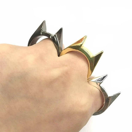 Stainless Steel Self-Defense Ring for Everyday Personal Safety shown worn on hand in silver and gold spike design