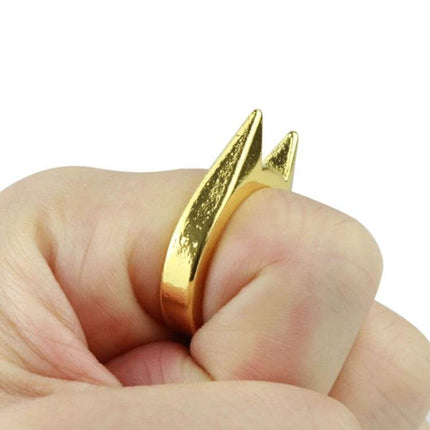 Stainless Steel Self-Defense Ring for Everyday Personal Safety shown in gold finish on a clenched fist for discreet protection