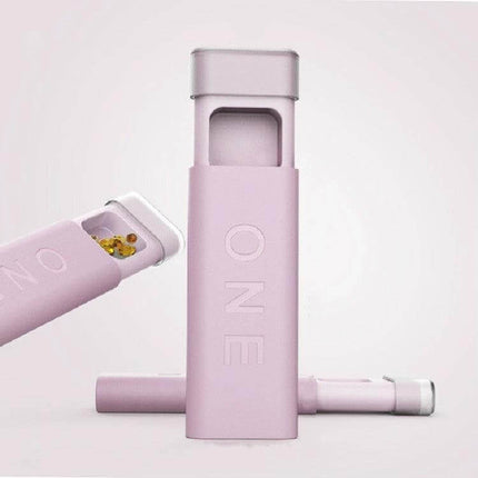 Portable Mini Dispensing Pill Box With Divided Storage in pink compact PP case showing open compartment with pills