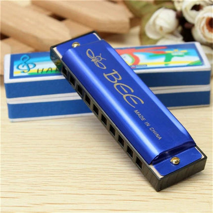 BEE's Compact Harmonica for Daily Music and Travel Use - blue pocket harmonica on wooden table with box