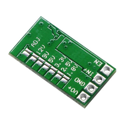 Compact DC-DC Step-Down Voltage Converter for Automotive Use green PCB module showing adjustable output pads and input/output terminals