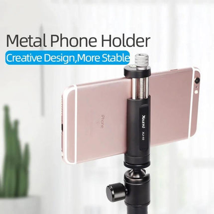 A Handy Tripod Clip for Daily Mobile Phone Mounting Solutions showing a metal phone holder mounted on a tripod holding a smartphone