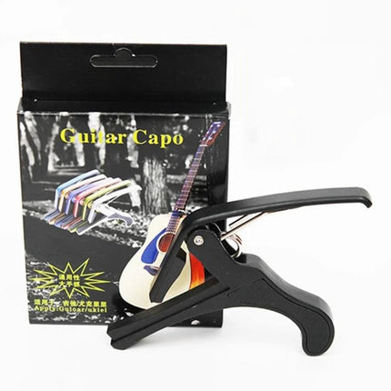 Versatile Plastic Guitar Capo for Acoustic and Electric Daily Use black plastic clamp capo with firm spring shown next to retail box