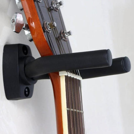 Wall Hook for Hanging Guitars and Ukuleles in Home Spaces metal wall mount holding acoustic guitar securely