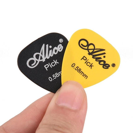 Essential Guitar Picks for Daily Music Practice at Home - close-up of black and yellow 0.58mm Alice guitar picks held between fingers