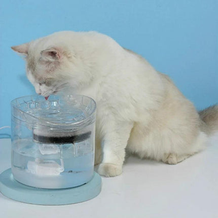 Essential Water Dispenser for Pets' Daily Home Hydration - white cat drinking from clear automatic pet water dispenser in home