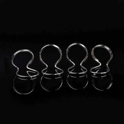 Durable Metal Spring Ring For Everyday Guitar Practice Sessions — four chrome practice finger support rings on black background