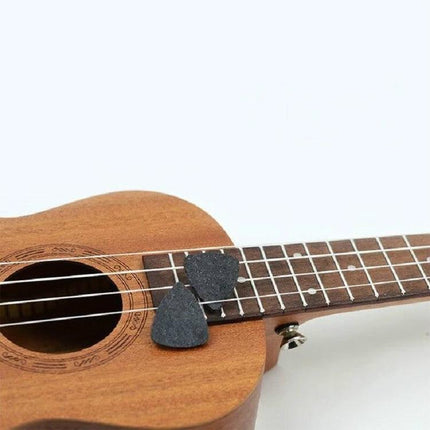 Wool Felt Picks for Everyday Ukulele and Guitar Practice on ukulele fretboard showing soft polyester felt picks protecting nails and producing clear sound