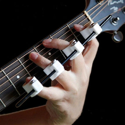 Handy Finger Expander for Everyday Music Practice Sessions on guitarist’s left hand warming up with lightweight ABS finger stretch tool