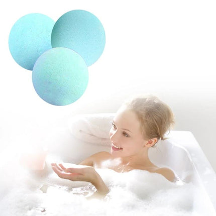 Set of Colorful Bath Bombs for Everyday Home Relaxation - three pastel blue bath bombs next to a woman enjoying a bubbly bathtub soak