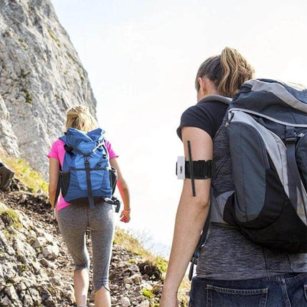 Outdoor One Handed Spinning Artery Tourniquet For Emergency First Aid on hiker arm showing compact one-handed tourniquet in outdoor emergency kit