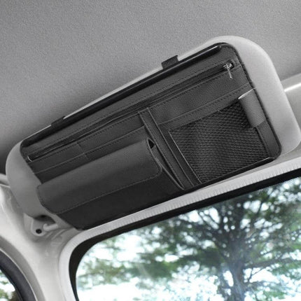 Car Sun Visor Organizer Case With Zipper For Glasses And Cards attached to visor holding phone, wallet, sunglasses and cards in zipped pockets
