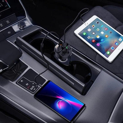 Car Bluetooth FM Transmitter And Charger, Hands-Free MP3 Player plugged into car console charging phone and tablet via dual USB