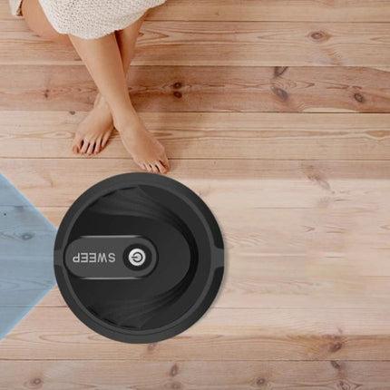 Household Sweeping Robot for Hair and Dust Cleaning quietly navigating wooden floor near bare feet, compact 23.5x6.5 cm for pet hair and dust