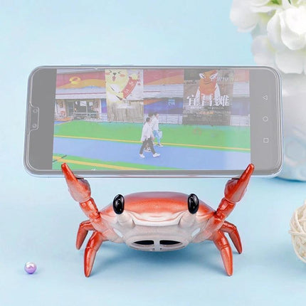 Crab-Style Mobile Phone Stand with Bluetooth Speaker and Pen Holder showing red crab holding smartphone for hands-free video and built-in speaker