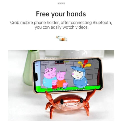 Crab-Style Mobile Phone Stand with Bluetooth Speaker and Pen Holder holding phone for hands-free video with built-in speaker on desk