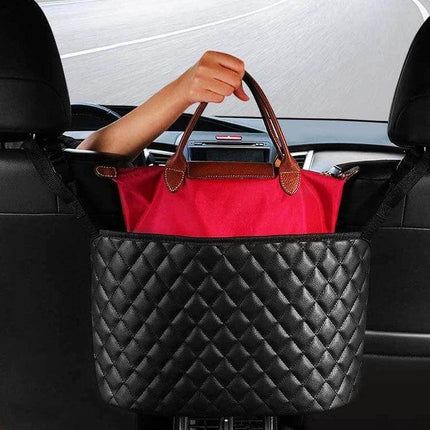Car Storage Net Pocket Between Seats for Organizing Small Essentials - black leather quilted organizer holding a red handbag between car seats (38x27x12 cm)