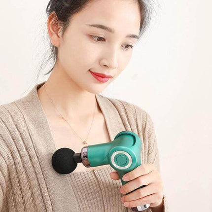 Fascia Gun Pocket Massage Folding 20 Speed For Relaxed Muscles - compact green pocket massage gun used on shoulder for post-workout relief