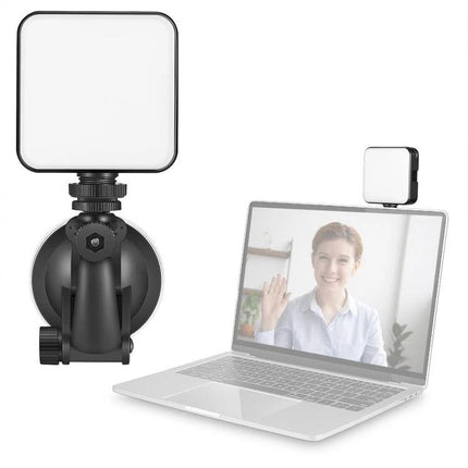 Light for Everyday Video Calls and Home Office Use LED panel mounted to laptop and suction arm to brighten face and desk for virtual meetings