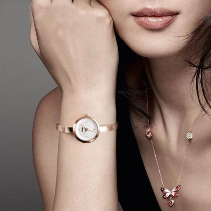 SKMEI Ladies Business Casual Stainless Steel Quartz Watch in Rose Gold on woman's wrist, elegant rose gold minimalist design