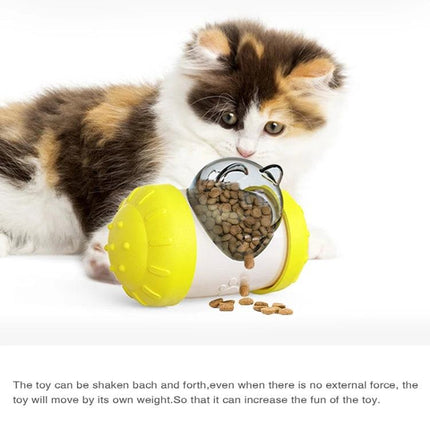 Interactive Balance Toy for Pets During Home Playtime - yellow plastic wobble feeder releasing kibbles as kitten bats it