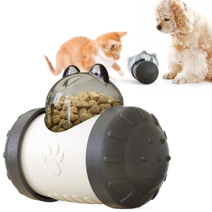Interactive Balance Toy for Pets During Home Playtime - wobbling plastic feeder dispensing kibble as cat and dog bat at it