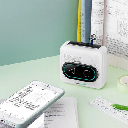 Memobird G4 Portable Thermal Printer for Student Notes printing study notes beside smartphone and textbooks