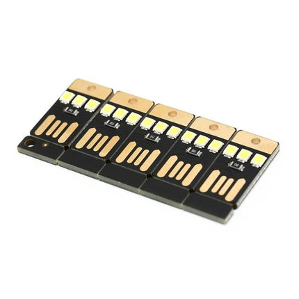 LED Keychain Light for Camping and Desk Use compact USB LED keychain light showing five small black circuit board lights for tent or desk illumination