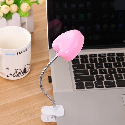 Heart-Shaped Clip Light for Evening Reading and Study clipped to laptop edge for focused late-night reading