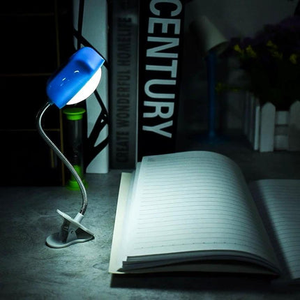 Heart-Shaped Clip Light for Evening Reading and Study illuminating open notebook on desk to reduce eye strain during late-night study
