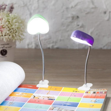 Heart-Shaped Clip Light for Evening Reading and Study clipped to textbook reducing eye strain during late-night revisions