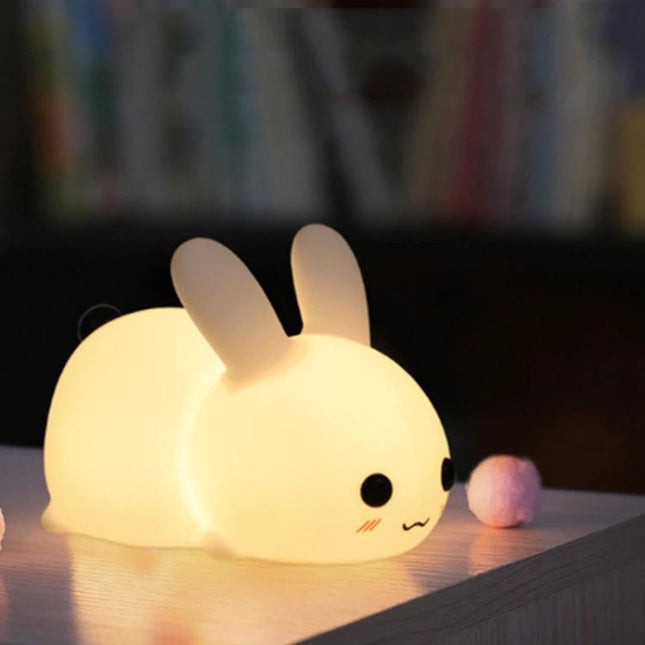 Soft Rabbit Night Light for Children's Bedtime Routines on a nightstand, soft silicone glow comforting children during bedtime