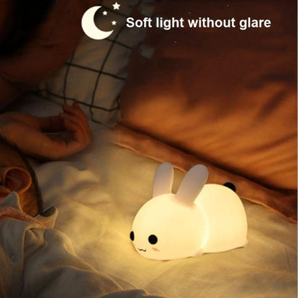 Soft Rabbit Night Light for Children's Bedtime Routines placed on nightstand emitting soft glow to soothe a sleeping child