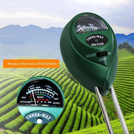 3-in-1 Soil Tester for Garden pH, Moisture, and Light Levels - green three-way meter with double probes in garden bed