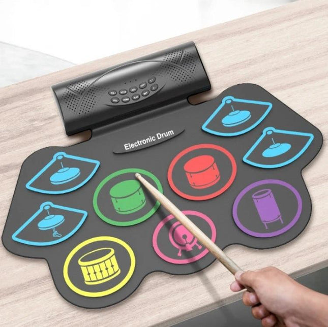 Electronic drum kit for beginner home music practice sessions compact foldable pad with colored drum pads and sticks for quiet apartment practice