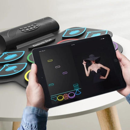 Electronic drum kit for beginner home music practice sessions - compact foldable pads with tablet app for quiet apartment practice