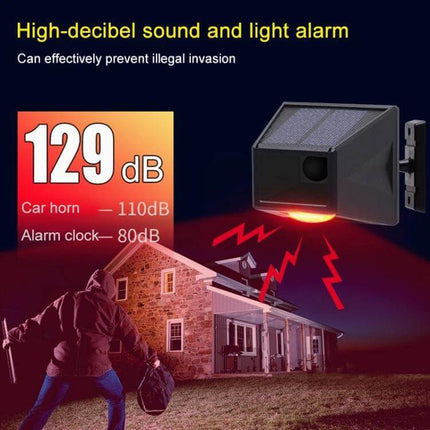 Wireless Solar Motion Sensor Alarm with Sound and Light mounted outdoors showing 129dB alert and flashing red LED deterrent