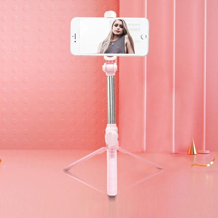 Tripod Selfie Stick for Everyday Photos and Group Shots - pink compact tripod selfie stick holding phone for hands-free group photos and videos